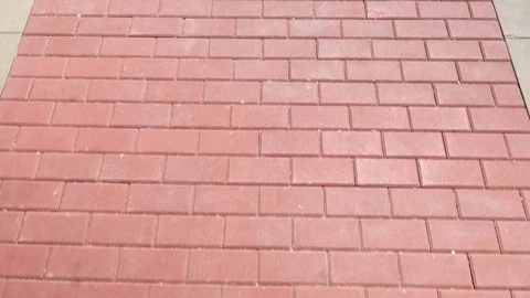 Red tile on sidewalk, looks under foot, soft motion by walking Stock Footage 111441155