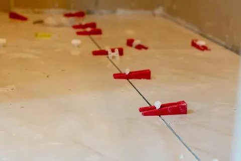 Red Tile Spacers on Construction Site Stock Photos