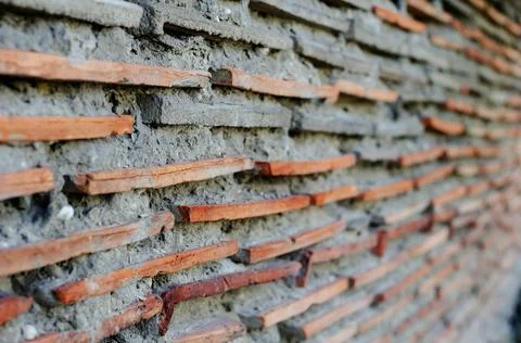 Red tile wall with gray cement in the distance perspective. Clay tile shingle Stock Photos