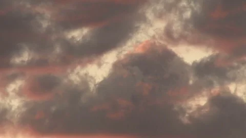 Red tinted cumulus clouds Stock Footage 74094091