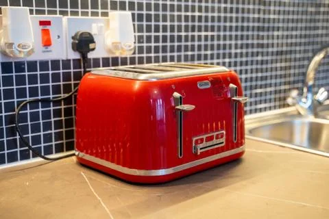 Red toaster in a nice kitchen Stock Photos