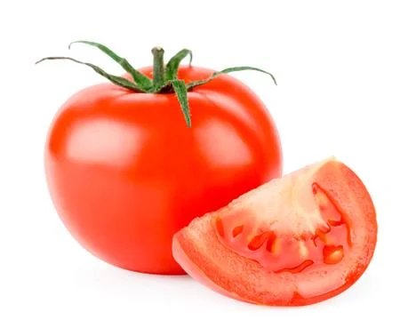 Red tomato and slice close up on a white. Isolated Stock Photos