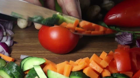 Red tomato are cut on a background of vegetables. Stock Footage 146877414