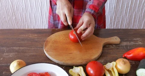 Red tomato cut using sharp knife, close-up, steadicam Stock Footage 114727092