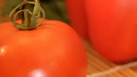 The red tomato is lying next to the sweet pepper, especially close-up Stock Footage 85609980