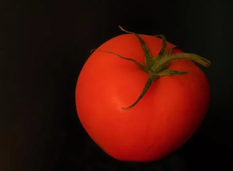 Red tomato on the table Stock Photos