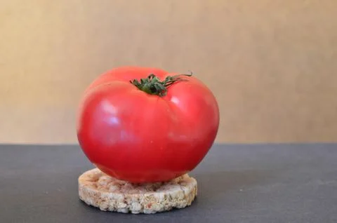 Red tomato on a wheat bread Stock-Fotos