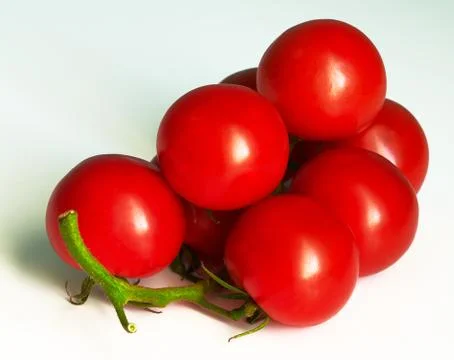 Red tomato on white background Stock Photos