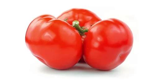 Red Tomatoes 360 degree turning on the white background. Full HD loop video Stock Footage 74479451
