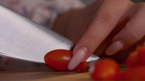 Red tomatoes are cut on a Board Stock Footage 140110412