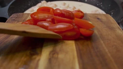 Red tomatoes are cut on a Board Stock Footage 140110451