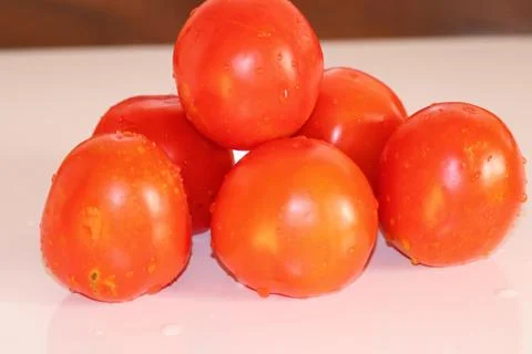 Red tomatoes background. Group of tomatoes - Image Stock Photos