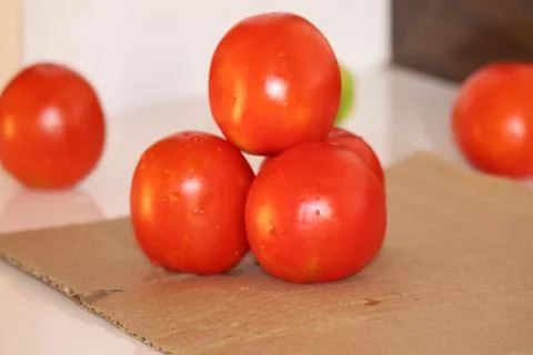 Red tomatoes background. Group of tomatoes - Image Stock Photos
