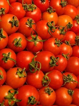 Red tomatoes background. Red tomatoes on the counter Stock Photos