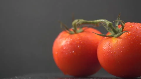 Red tomatoes on black background Stock-Footage 134660050