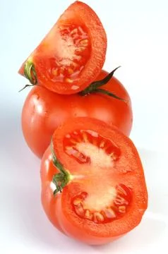 Red tomatoes on a blue background Stock Photos