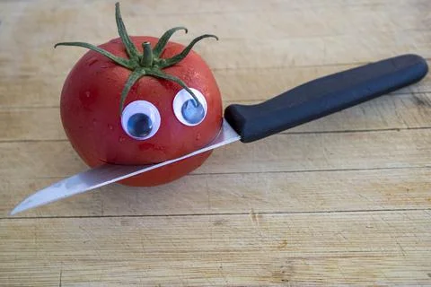 	Red tomatoes on the breadboard Stock Photos