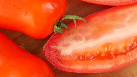 Red tomatoes on a cutting board. 스톡 동영상 224746829