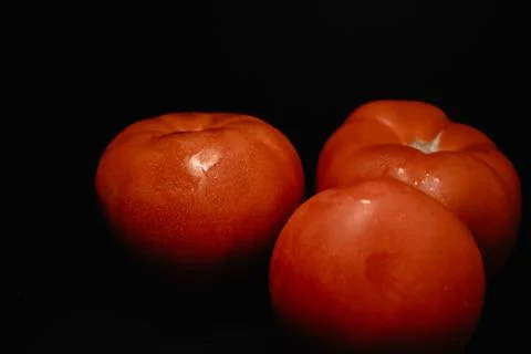 Red tomatoes with dark background Stock Photos