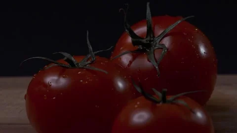 Red tomatoes with a dripping drop Stock Footage 140114644
