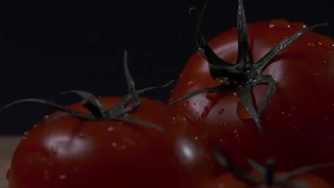 Red tomatoes with a dripping drop Stock Footage 140114711