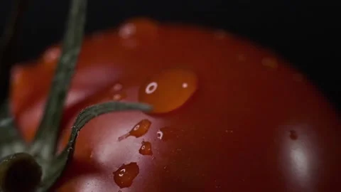 Red tomatoes with a dripping drop Stock Footage 140115010