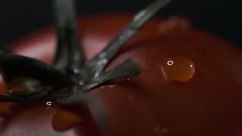 Red tomatoes with a dripping drop Stock Footage 140115275