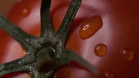 Red tomatoes with a dripping drop Stock Footage 140115384