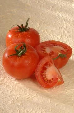 Red tomatoes on a gray background Stock Photos