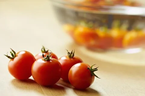 Red tomatoes on kitchen table Stock Photos