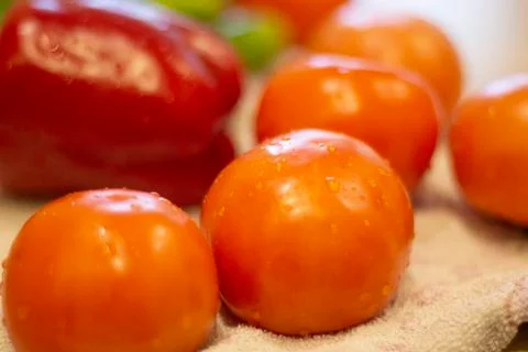 Red tomatoes lie on the table close-up Stock Photos