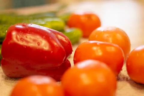 Red tomatoes lie on the table close-up Stock Photos
