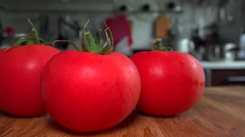 Red tomatoes lie on the table Stock Footage 132104629