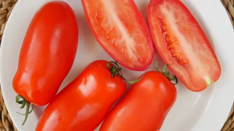 Red tomatoes on a plate. Stock Footage 224438782