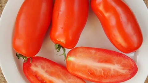 Red tomatoes on a plate. Stock Footage 224930020