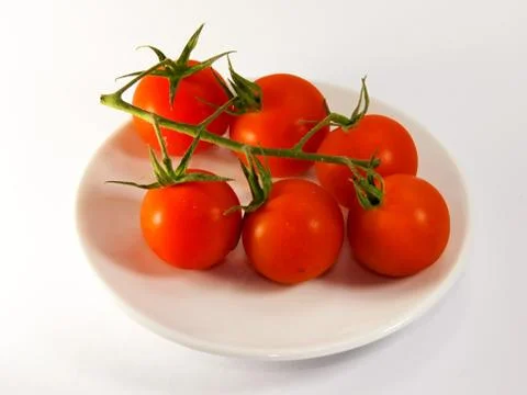 Red tomatoes on a plate Stock Photos