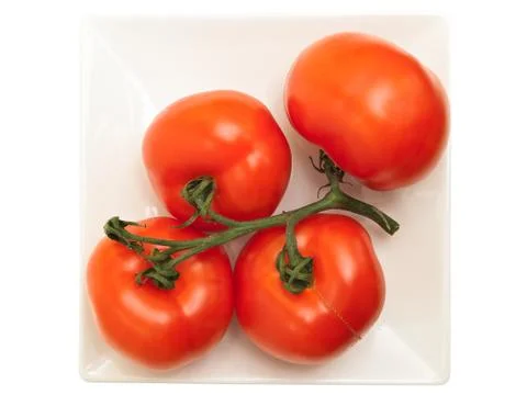 Red Tomatoes on the Plate Stock Photos