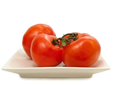 Red Tomatoes on the Plate Stock Photos