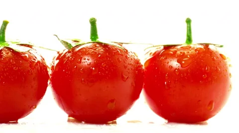 Red tomatoes  on a white background Stock Footage 47884732