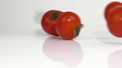 Red tomatoes on a white background Stock Footage 83054486