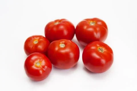 Red tomatoes on a white background Stock Photos