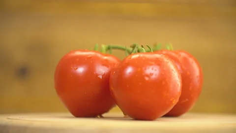 Red tomatoes on a wooden table Stock Footage 115077003