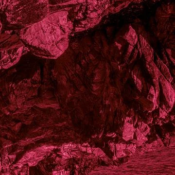 Red-toned rocky texture with bold contrast and dramatic abstract pattern Stock Photos