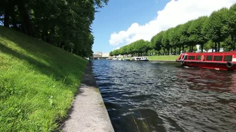 Red Tour ship in inland river, St. Petersburg, Russia Stock Footage