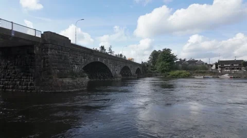 Red Tractor and Yellow Van Crossing River Bann Bridge at Portglenone 動画素材 317701523