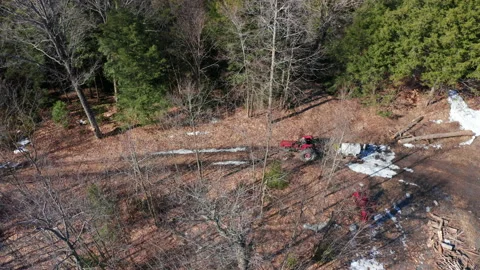 Red Tractor Driving Down Trails Collecting Sap From Maple Trees For Sugar Shack Stock Footage 151712515