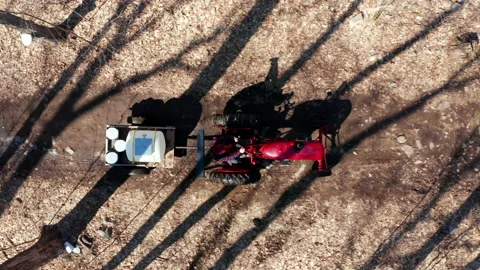 Red Tractor Driving Down Trails Sugar Shack in Quebec Canada Aerial Drone Shot Stock Footage 151713584