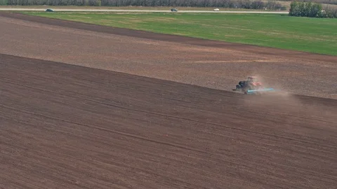 Red Tractor In The Field On A Spring Day Video stock 88694750