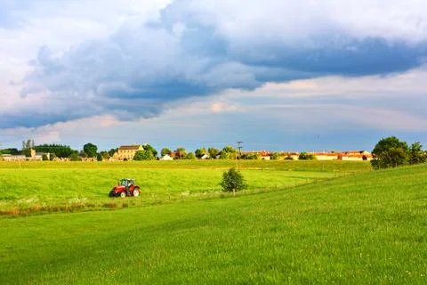 A red tractor in the fields of scotland, springtime Stock Photos