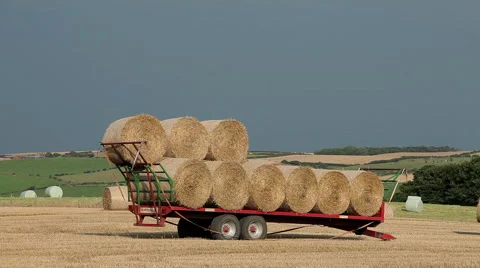 RED TRACTOR LOADS TRAILER, A174 NORTH YORKSHIRE, ENGLAND Stock Footage 46478029